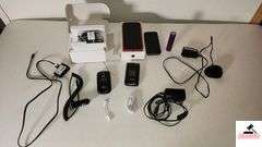 CELLPHONES AND PHONE CHARGERS - IPHONE HEAD PHONE CORD - (2) SMART PHONES - (2) FLIP PHONES, VERIZON LG, AICOTEL - POWERBANK ON THE GO CHARGER - (NE BEDROOM CLOSET)