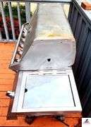BRINKMANN GAS GRILL - TOP IS 17 1/2" DEEP X 35 1/2" WIDE - SIDE BURNER - APPEARS BEEN PAINTED - ROLLING FEET MISSING / BENT - PROPANE TANK INCLUDED - COVER - (PATIO)