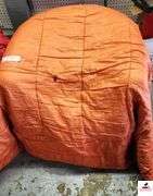 (2) SLEEPING BAGS - RED AND ORANGE - BAG OF TOWELS AND WASH CLOTHES - DEPENDS AND LADIES PADS - (GARAGE)