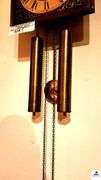 TEMPUS FUGIT WALL CLOCK - WEIGHTS - SHOW AGE - BRASS PENDULUM - CHAINS - ROMAN NUMERALS BRASS FACE - OPERATING CONDITION UNKNOWN MADE IN GERMANY - (GREAT ROOM)