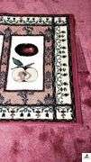 AREA RUG - 39" X 56 3/4" LONG - TIGHT WEAVE - PINK RED, 3 FRUIT PATTERN - PEARS, CHERRIES, APPLES (NW BEDROOM)