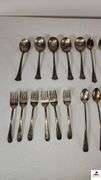 (24) TOTAL PCS. - (5) SUGAR SHELLS - (4) ICE TEA SPOONS - (6) SALAD FORKS - (2) ICE TEA SPOONS -  PICKLE FORK - BUTTER KNIFE - TEA SPOON - SERVING FORK - ETC. - (MAPLE HUTCH GREAT ROOM)