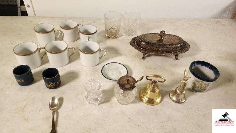 CUT SALAD THING WITH SILVER PLATE TOP - LITTLE SEAGULL BELL - BRASS BELL - (6) FFF CHINA CUPS - (2) CUT GLASS SMALL TUMBLERS - SILVER PLATE - FOOTED SERVING DISH WITH COVER - MISC PC. - (GARAGE)
