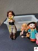 (4) CLOTH DOLLS - ONE NOSE DAMAGED - (GARAGE)