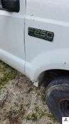 2000 FORD F250 XL SUPER DUTY PICK UP TRUCK - 202,414 MILES - 4 SPEED FLOOR SHIFT - 2 DOOR 0 V10,6.8L  -GASOLINE - INDSHIELD CRACKED - FRONT BUMPER DENTED AND SHOWS RUST - HOOD DENTED WITH RUST SPOT - DRIVERS SIDE DOOR FRONT FENDER AND DOOR BENT, TOP OF REAR REAR QUARTER PANEL DENTED TAILGATE DENTED, SCRATCHED, AND PUNCTURED - BUMPER SHOWS RUST AND DENTED- SIDE MOUNTED TOOL BOXES WITH RUST - PASSENGERS SIDE REAR QUARTER PANEL BENT IN SEVERAL PLACES WITH SCRATCHES, FRONT FENDER WHEEL DENTED - NUMEROUS SCRATCHES, WEAR, AND PECKS - SEATS SHOW WEAR AND HOLES  - VIN# 1FTNF20S0YEB61867