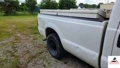 2000 FORD F250 XL SUPER DUTY PICK UP TRUCK - 202,414 MILES - 4 SPEED FLOOR SHIFT - 2 DOOR 0 V10,6.8L  -GASOLINE - INDSHIELD CRACKED - FRONT BUMPER DENTED AND SHOWS RUST - HOOD DENTED WITH RUST SPOT - DRIVERS SIDE DOOR FRONT FENDER AND DOOR BENT, TOP OF REAR REAR QUARTER PANEL DENTED TAILGATE DENTED, SCRATCHED, AND PUNCTURED - BUMPER SHOWS RUST AND DENTED- SIDE MOUNTED TOOL BOXES WITH RUST - PASSENGERS SIDE REAR QUARTER PANEL BENT IN SEVERAL PLACES WITH SCRATCHES, FRONT FENDER WHEEL DENTED - NUMEROUS SCRATCHES, WEAR, AND PECKS - SEATS SHOW WEAR AND HOLES  - VIN# 1FTNF20S0YEB61867