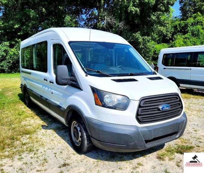 2017 FORD TRANSIT VAN - V6, 3.5L TURBO ECO BOOST - 236,608 MILES - RUNNING BOARD STEP MISSINGS - SMALL PAINT PECKS ON HOOD - CHIP DRIVERS SIDE - NEEDS CLEANING WERE LETTERS WERE ON VAN - PAINT PECK PASSENGERS SIDE RUNNING BOARD STEP MISSING - TOP PASSENGERS SIDE REAR PANEL CORNER MOLDING BENT - FRONT MOLDING SLIGHTLY BENT - SMALL HOLE IN LINING ON REAR DOOR DRIVERS SIDE INTERIOR - HEAD LIGHT COVERS SLIGHTLY FADED - CLEAN INTERIOR - FOLDING SEATS 3 DOUBLES AND 2 SINGLES - BRAUNABILITY CENTURY SERIES CHAIR LIFT - DOUBLE REAR DOORS - 10 CAPACITY (2 FRONT AND 8 REAR)  - HAS NOISY REAR AXLE (NEEDS REPAIR)V/N:  1FDZX2CG4HKB54472 image