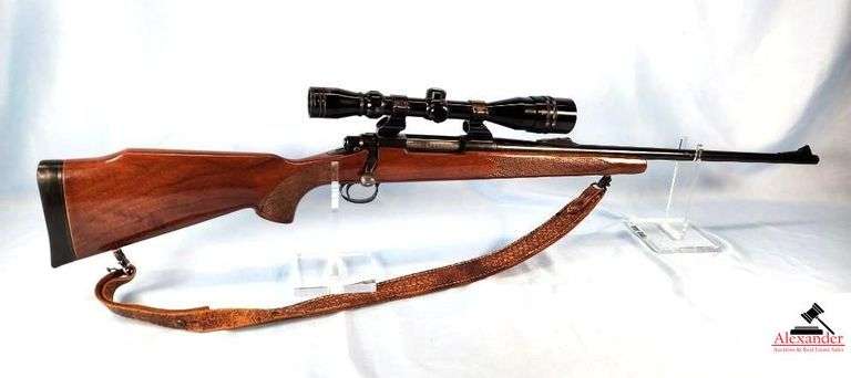 REMINGTON MODEL 700 RIFLE - 7MM REM MAG - JEWELED BOLT - RIGHT HAND CHEEK REST - HIGH COUNTRY SCOPE 6-24X40 - SEE THROUGH SIGHTS - CHECKERED PISTOL GRIP STOCK AND FOREARM - CHECKER HAS COUPLE OF SMALL PECKS - FEW MARKS IN THE FINISH - FEW MINOR MARKS AND CARRY WEAR - BLUING GOOD - COUPLE OF SMALL SPOTS ON BARREL - SLING SWIVELS - S/N A6571597 image