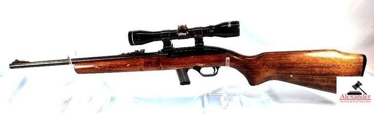 MAGTECH RECREATIONAL PRODUCTS 7022 RIFLE - .22LR SEMI-AUTO - TESCO LONGHORN SCOPE - STOCK SHOWS CARRY WEAR & FEW SCRATCHES - FOREARM HAS SOME RUBS & SCRATCHES, PECKS - RECEIVER BLUING IS GOOD - BARREL BLUING IS GOOD AND SMOOTH - SCOPE HAS FEW SCRATCHES - S/N E004973 image