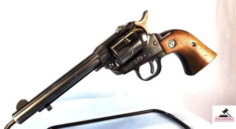 RUGER SINGLE SIX REVOLVER – 22 CAL SINGLE ACTION – BROWN RUGER GRIPS – CORNER OF WALNUT GRIP LEFT SIDE SPLIT – SHOWS CARRY AND USE WEAR – BLUING GOOD AND SMOOTH – SMALL CIRCLE ON BBL – S/N 803062 image