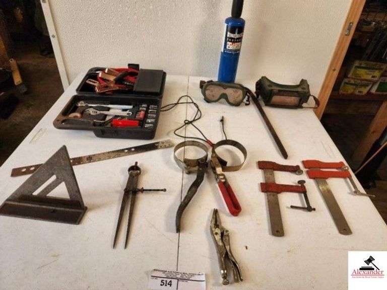 TRAVEL EMERGENCY KIT WRENCHES AND JUMPER CABLES - C-CLAMPS - BEANZOMATIC PROPANE BURNER - WELDING GOGGLES - RULER - ALUMINUM SQUARE - CALIBERS - OIL WRENCHES (TRAILER) image