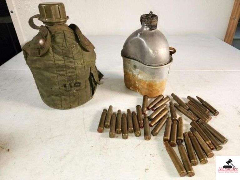 CANTEEN IN POUCH MARKED US METAL CANTEEN - SHOWS RUST ON CAN AND HAS A DENT - INVENTORY OF US MILITARY RIFLE BLANKS - BELIEVED TO BE 30-06, NO GUARANTEE - 1 LIVE ROUND - (GARAGE) image
