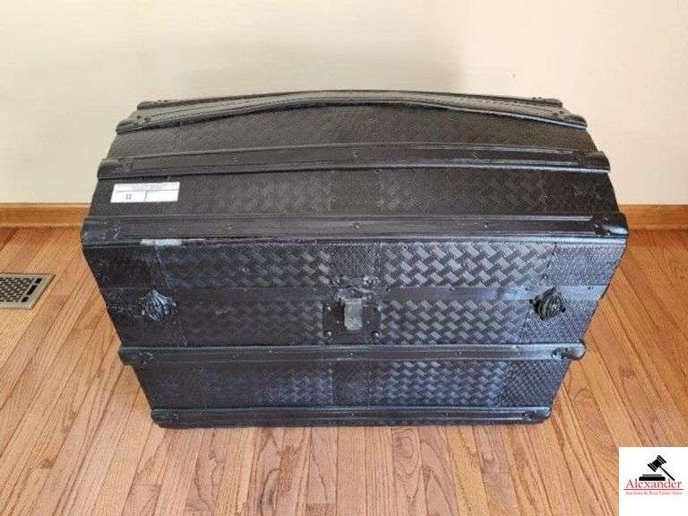 BLACK OVAL TYPE TRUNK - 32" X 23 1/2" - OVAL TOP - WOOD STRAPS, METAL HARDWARE, WHITE INTERIOR WITH STORAGE DRAWER AND TRAY - (LR) image