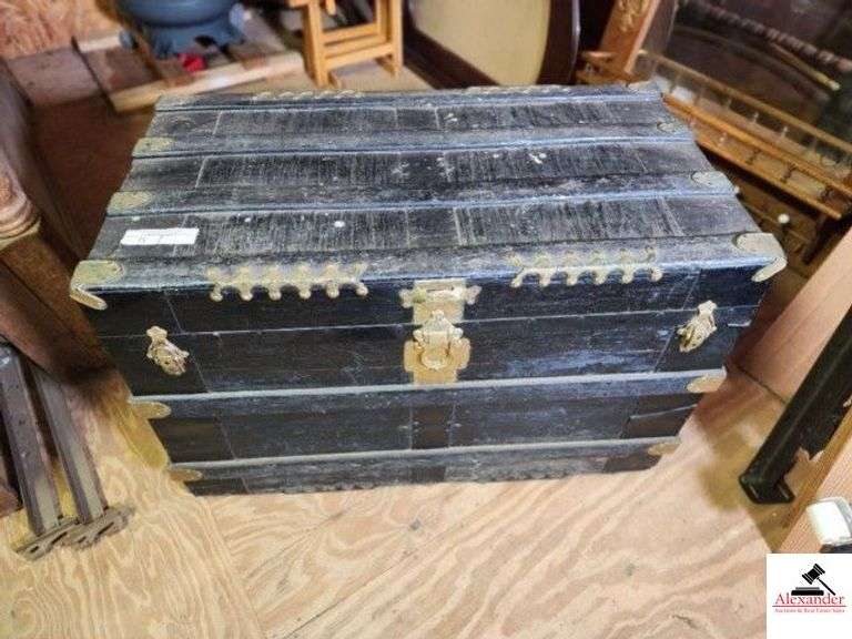 BLACK TRAVEL TRUNK WITH BANDS - BRASS HARDWARE 38" WIDE X 21" DEEP X 24" - HANDLE MISSING - TOP BOARDS ARE SEPARATED AND SHOW WEAR - BOTTOM SHOWS WEAR - NO TRAY INSIDE - (UPSTAIRS) image