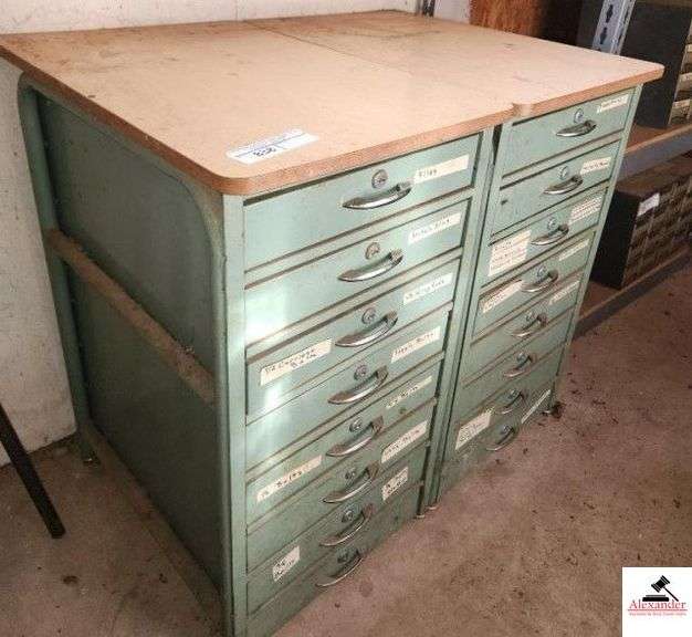 (2) 8-DRAWER BOLT CABINETS 2 SECTIONS W/FORMICA TOPS - INCLUDED EMBEMLEM FOR IT - ASSORTMENT OF WELDING RODS - THREADED BOLTS - VARIOUS LENGTHS OF BOLTS, VARIOUS SIZES - SMALL U BOLTS - PULLEY WHEELS - STAPLES - VINYL LETTERS - TRAILER  LIGHTBULBS - MISC PLASTIC PARTS - WASHERS - (SHOP) image