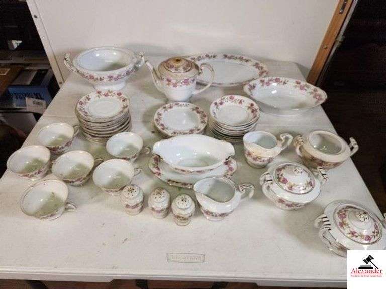 VALMONT CHINA - BRIAR ROSE PATTERN MADE IN JAPAN - 2 PARTIAL SETS COMBINED - 11 DINNER PLATES, 1 CHIPPED - 2 SALAD BOWLS, 1 CHIPPED - 2 SERVING PLATTERS - 2 SERVING ROUND BOWLS - 2 GRAVY BOWLS, 1 HAS SMALL CHIP - 6 CUPS - 11 SAUCERS, 1 HAS SMALL CHIP - 8 CEREAL BOWLS - 4 CAKE PLATES - TEA POT, CROWN IS BROKEN - 9 SUGAR BOWLS - 3 SHAKERS - CREAMER & 2 SUGAR BOWLS WITH LID - CREAMER & SUGAR WITHOUT LID - PEDESTAL HANDLED BOWL - OBLONG SERVING BOWL - NEED WASHED  (UPSTAIRS) image