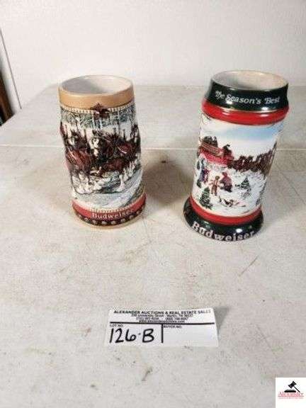 (2) ANHEUSER-BUSCH, INC OPEN BEER MUG 1988 COLLECTOR'S SERIES - "THE TRADITION OF THE WORLD FAMOUS BUDWEISER CLYDESDALES CONTINUES. THIS SPECIAL EDITION STEIN SHOWS THE HITCH IN FESTIVE HOIDAY HARNESS CROSSING A COUNTRY BRIDGE." - 1991 COLLECTOR'S SERIES - "THE SEASON'S BEST" - "THE WORLD FAMOUS BUDWEISER CLYDESDALES 8-HORSE HITCH AND WAGON RENDERED BY ARTIST SUSAN SAMPSON - ANHEUSER BUDWEISER HITCH WEST GERMANY STONEWARE - (UPSTAIRS) image