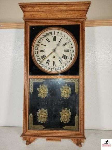 OAK VINTAGE KITCHEN WALL CLOCK - WHITE FACE ROMAN NUMBERAL NUMBERS - REGULATOR STYLE - 31 DAYS NUMBERAL NUMBER - GLASS FRONT - PENDELUM AND KEY - FLOWER DESIGNS ON GLASS - 18" X 30 1/2" - (SIDE BEDROOM) image