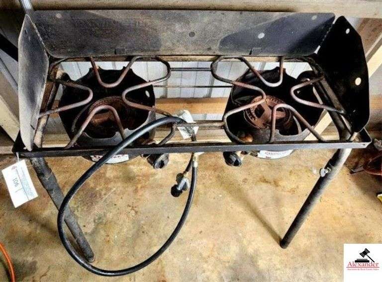 EXPLORER CAMP CHEF MODULAR COOKING SYSTEM GAS - TWO BURNERS - FISH COOKER - ON STAND - 33"W X 14"D X 29"T -  PARTIALLY FULL PROPANE TANK - 2 EXPANDABLE RAIL RACKS - (SHED) image