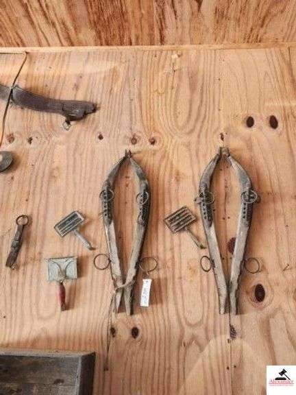 PAIR OF HORSE HANGS WITH HARNESS RINGS WOOD AND METAL - 3 CURRY COMBS, LETHER BRASS COLLAR THAT IS DRY ROTTED - NEEDS REPAIR - (GARAGE) image