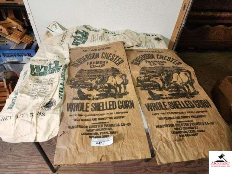 (4) SEED BAGS (2) WILL LADINO CLOVER CLOTH BAGS - RIM IS TORN ON ONE BAG - (2) VINTAGE HENDERSON CHESTER FARMERS CO-OP WHOLE SHELLED CORN PAPER BAGS - BAGS ARE USED - (UPSTAIRS) image