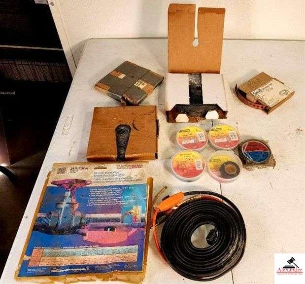 BOXES OF PIPE STRAPPING - COPPER HANGER STRAP ALUMINUM STRAPPING - BLACK ELECTRICAL TAPE - ELECTRIC WATER PIPE FREEZE PROTECTION TABLE (SHOP) image