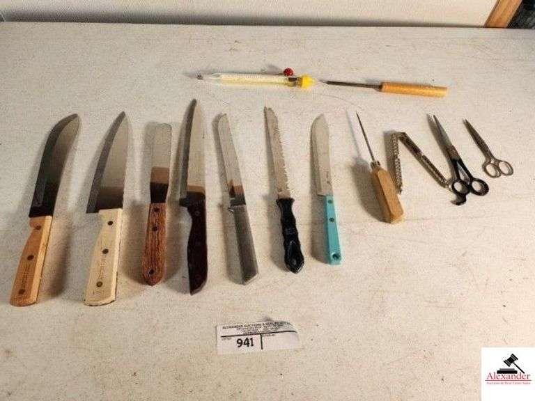 BUTCHER CARVING KNIVES - CHEF DELIGHT SIGNED R.C. STAINLESS - CHEF DELIGHT CHEF KNIFE - WILTON CAKE KNIFE - WHITEHALL STAINLESS SIGNED R. T. C. HEAVY BUTCHER KNIFE - ALUMINUM RTC KNIFE - SERRATED KNIFE - IKCO ETERNA BUTCHER KNIFE - ICE PICK - SCISSORS - PROBE COOKING THERMOMETER - (12) OUTKUT STEAK KNIVES - YELLOW HANDLES - (10) BROWN HANDLED STEAK KNIVES - TOMATO KNIFE (GARAGE) image