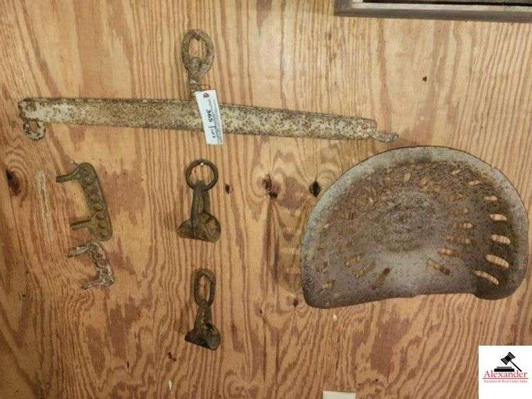 ANTIQUE STEEL SINGLE TREE ONE HOOK IS BROKEN - METAL IMPLIMENT SEAT - BOTTOM IS RUSTY - (2) PLOW CONNECTORS - (2) HAND FORGED YOKE RINGS FOR SINGLE TREE - 2 PLY CONNECTORS - 2 VINTAGE HORSE DRAWN PLOW HINGE PARTS - LARGE CULIVATER PLOW POINTS AND TURNING POINTS - (GARAGE) image