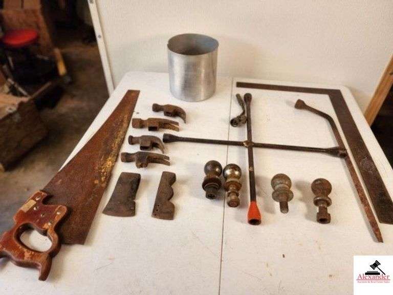 (4) HAMMER HEADS HATCHET HEAD - ROOFING HAMMER HEAD - HAND SAW (NEEDS CLEANING) - LARGE 4 WAY WRENCH - T SQUARE - TRAILER HITCH BALLS - (TRAILER) image