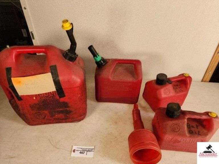 6 GALLON TANK OF HERBICIDE MIX - 2 GALLON GAS JUG - (2) 1 GALLON GAS JUG - FUNNEL - (SHED) image