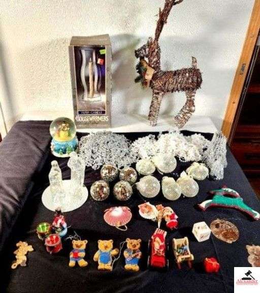 MUSICAL SNOWMAN GLOBE - WORKS - PRISM ORNAMENTS - SILVER AND WHITE BEAD GARLAND - HOUSEWARMERS HURRI-CANDLE CANDLES BY CORNING - WICKER REINDEER - WHITE & SILVER ORNAMENTS - GLASS MARY, JOSEPH, AND JESUS SET ON MIRROR - MISC ORNAMENTS - (UPSTAIRS) image
