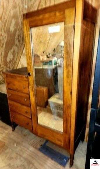 VINTAGE CHIFFAROBE - GLASS DOOR - 4 DRAWERS SOME OF THE WOOD PIECED WILL NEED REPAIRED AT THE TOP - SEAT CUSION HAS TEAR - ONE WHEEL HAS FALLEN OFF - MIRROR IS FADED SOME - PART OF THE LATCH IS MISSING - (UPSTAIRS) image