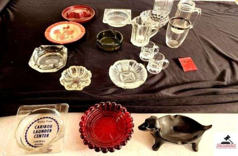 (10) ASHTRAYS - GLASS & PLASTIC SOME ADVERTISEMENT TRAYS - SMOKEY MTN. - MINITURE MUGS - CUPS - BOWLS - RUBY RED ASHTRAY - DACHSHUND ASHTRAY - GLASS VASE - (GARAGE) image