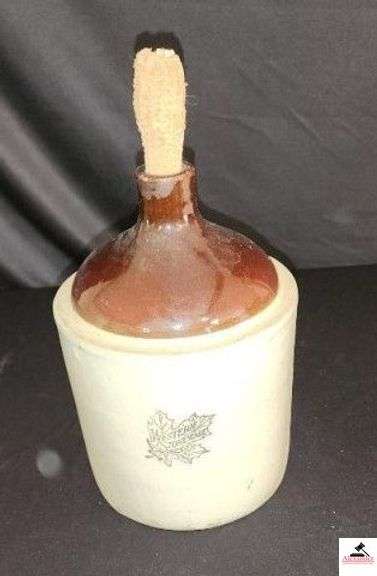 WESTERN STONEWARE JUG - CORN COB STOPPER - BROWN AND WHITE - BLUE LEAF WITH NAME ON FRONT - (KITCHEN) image