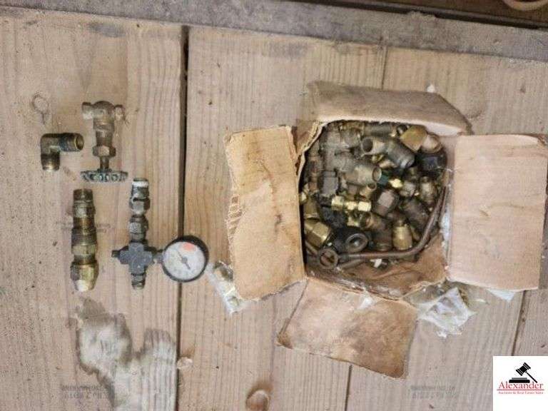 PLASTIC CRATE OF PIPE UNION AND PARTS - NEW AND USED - ELECTRIC WIRE CLAMPS - PLASTIC BUCKET OF PARTS - GALVANIZED AND BRASS PLUMBING SUPPLIES -TROPHIES -  (IMP. SHED) image