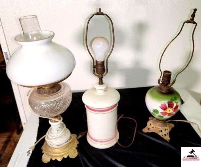 (3) LAMPS ELECTRIFIED OIL LAMP - GOLD METAL BASE - PAINTED STEM - GLASS DESIGN FONT - WHITE GOLD SHADE & CHIMNEY WHITE GLOBE IS CHIPPED - CHINA LAMP WITH PINK RIM - ELECTRIFIED OIL LAMP BASE - NO CORD - ELECTRICAL WIRING IS WORN - (UPSTAIRS) image