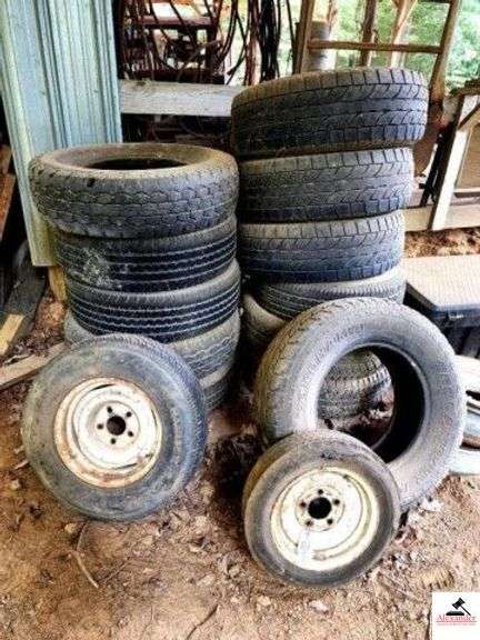 BOAT TRAILER RIM AND TIRE 4.8-12 5 HOLE - (2) RIMS - 5 HOLE - HANCOCK TIRE P205/75/R14 - (12) ADDITIONAL TRUCK TIRES (IMP. SHED) image