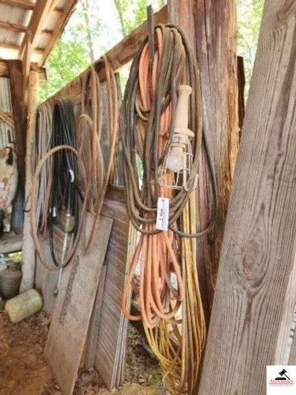 EXTENSION CORDS - HEAVY DUTY APPOX. 50+ FT. YELLOW CORD- ORANGE CORC TRIPLE PLUG - (IMP SHED) image