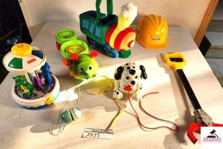 BABY TOYS FISHER PRICE MERRY-GO-ROUND (CONDITION UNKNOWN) - CATAPILLAR ON A STRING - DOG ON A STRING - TONKA CONSTRUCTION HAT - PLASTIC GRABBER - YO-YO - SOFT TRAIN PLUSH - (GARAGE) image
