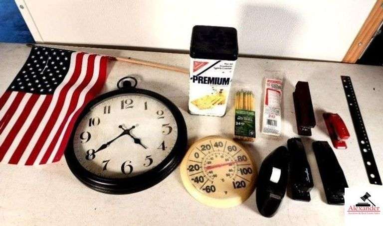BATTERY WALL CLOCK - MISC ITEMS PREMIUM CRACKER TIN - THERMOMETER - OFFICE SUPPLIES - STAPLERS - TAPE DISPENSER - SMALL AMERICAN FLAG - (GARAGE) image