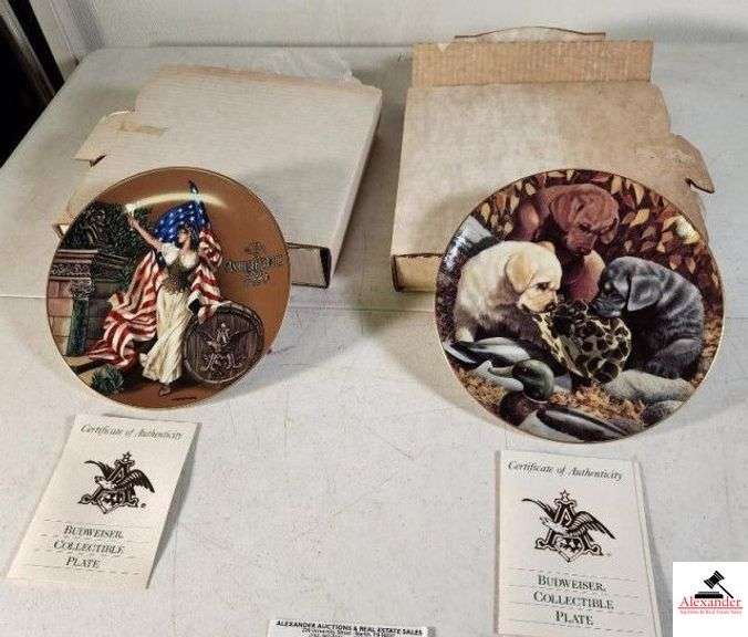 (2) BUDWEISER COLLECTIBLE PLATES WITH COLA LADY WITH AMERICAN FLAG - "1893 COLUMBIAN EXPOSITION" FIRST ISSUE - BUDWEISER ARCHIVES SERIES PLATE COLLECTION - PLATE NUMBER 0846 - LAB PUPPIES CHEWING ON CAMO HAT - "SOMETHING'S BREWING" BY MARLOWE URDAHL - BUDWEISER MAN'S BEST FRIENDS COLLECTION - PLATE NUMBER 1096 -  BOTH PLATES COME WITH CERTIFICATE OF AUTHENTICITY - (UPSTAIRS) image