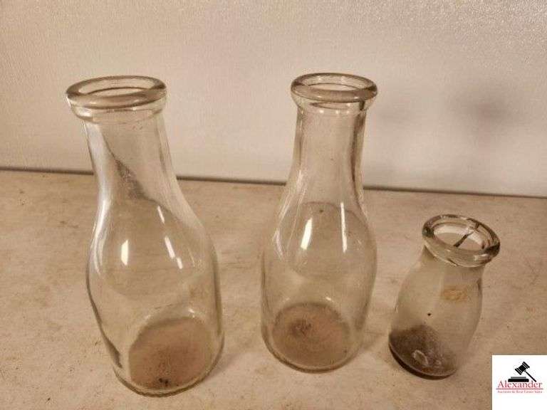 2 VINTAGE MILK BOTTLES - SMALL MILK BOTTLE SMALL MILK BOTTLE HAS CHIP - NO. 28 ON BOTTOM & L STAMP - (GARAGE) image