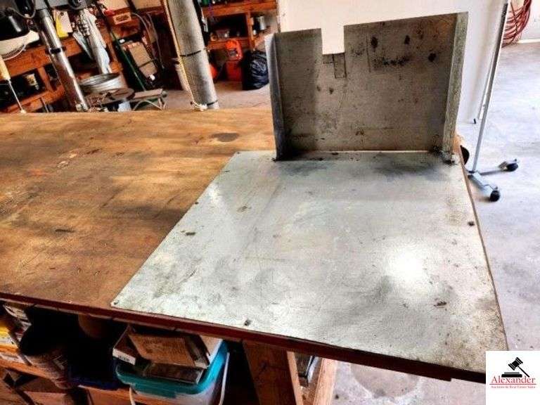 WOOD SHOP TABLE 36" WIDE X 7' LONG X 38" TALL - 2X4 CONSTRUCTION - PLYWOOD TOP - ALUMINUM GUARD ON ONE END - BOSTON PENCIL SHARPENER - ELECTRIC HOOK UP - WOOD STORAGE CLAMP - TABLE ONLY - NO INVENTORY - (SHOP) image