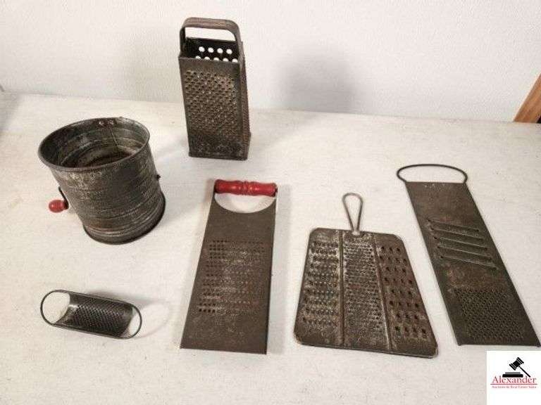 TIN KITCHEN UTENSILS SIMPLEX GRADER WITH RED HANDLE - SHOWS RUBS AND USE WEAR - GOOD CONDITION - TRIPLE FINE SHREDDER - GRADER - COURSE GRADER - GADGET MASTER PROP MODEL 8 - MADE IN USA - HEAVY SLICER HAND GRADER - RAPID SLAW AND VEGATABLE CUTTER - BROMWELL MEASURING SIFTER 2-5 CUPS - SHOWS SOME WEAR - MINI OVAL CHEESE GRADER - UPRIGHT TAPERED GRADER - (GARAGE) image