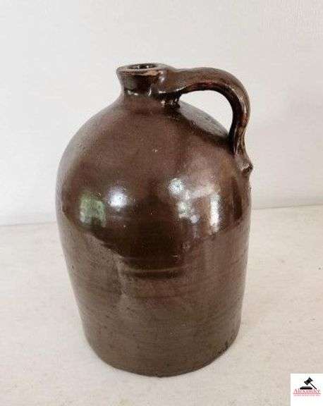 STONEWARE JUG #3 W/ HANDLE - BROWN - SMALL CHIP ON RIM - 9" BASE -13 1/2" TALL - (KITCHEN) image