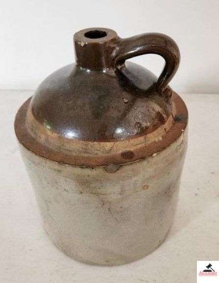STONEWARE JUG W/ HANDLE - BROWN AND WHITE - CHIPS ON RIM - 9 1/2" BASE - 12" TALL - (KITCHEN) image