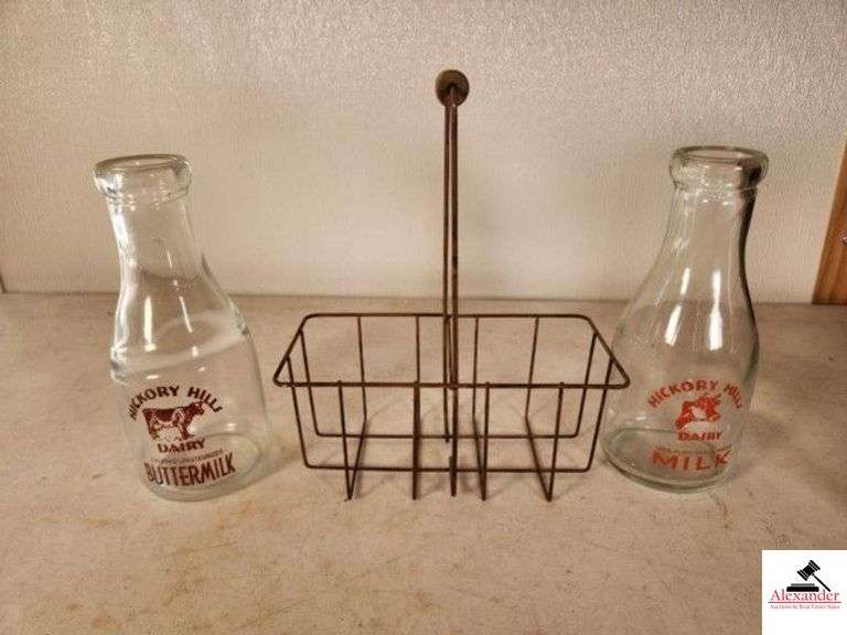 2 HICKORY HILLS MILK & BUTTERMILK BOTTLES WITH WIRE CARRIER AND WOODEN HANDLE- BUTTERMILK BOTTLE WITH COW - MILK BOTTLE WITH COW HEAD - (GARAGE) image