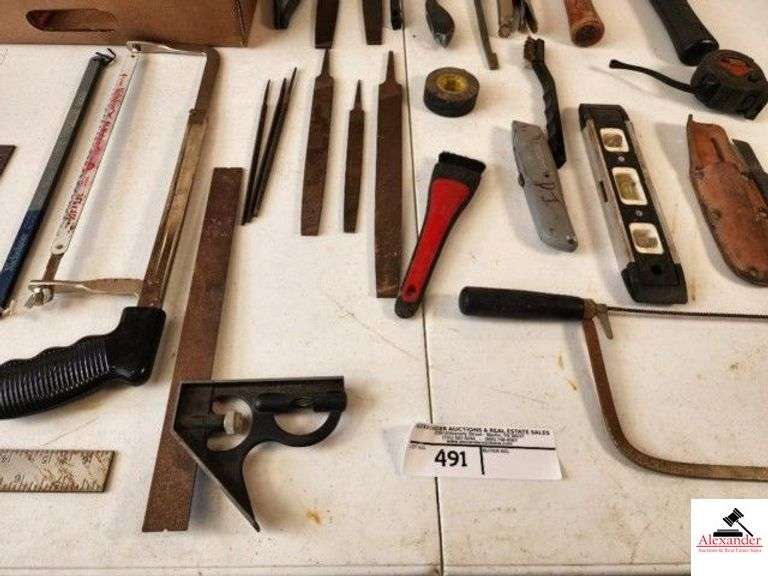NEW BEARINGS - HACK SAW - METAL SQUARE - CARPENTER SQUARE - CHANNEL LOCKS - VISE GRIPS - SMALL LEVEL - BALL PING HAMMER - CLAW HAMMER - MEASURING TAPE - FILES - HAND SABER SAW - BOX CUTTER - MOTORCRAFT SPARK PLUGS - CUTTER IN LEATHER POUCH - (TRAILER) image