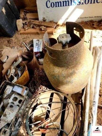 PALLET - BOLTS - PROPANE TANK FAN BLADE - USED ELECTRICAL BOXES - CHAIN LINK FENCE PARTS - ANTIQUE WOOD CORNER PORCH BRACKETS - ELECTRIC WIRE - CAR CHAINS - SMALL YARD RACK - BARBELL PLATE - SAW BLADE - ETC (IMP. SHED) image