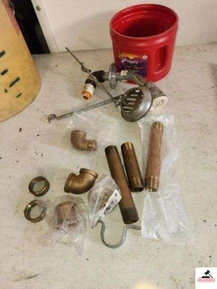 BUCKET OF PLUMBING SUPPLIES - MISC BRASS CUT OFFS - FAUCETS - COPPER - GALVANIZED BUCKET HAS LOTS OF CONDUIT SNAPS & CONNECTORS -4" X 8" FORMED FL CORNERS - SET SCREW CONNECTORS - BRASS PIPES - ELBOW CONNECTORS - REPAIR PARTS NEW & USED ITEMS - MOSTLY NEW - (SHED) image